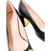 Close-up macro shot of the Gucci Baby Pump interior, showcasing the gold foil stamped Gucci logo on the premium leather insole.