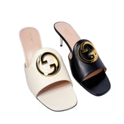 Underside view of the white Gucci Blondie mule sandal, displaying the smooth premium leather outsole and debossed luxury designer branding.