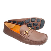 Bottom view of Gucci brown leather Horsebit loafer displaying rubber pebble tread driver sole.