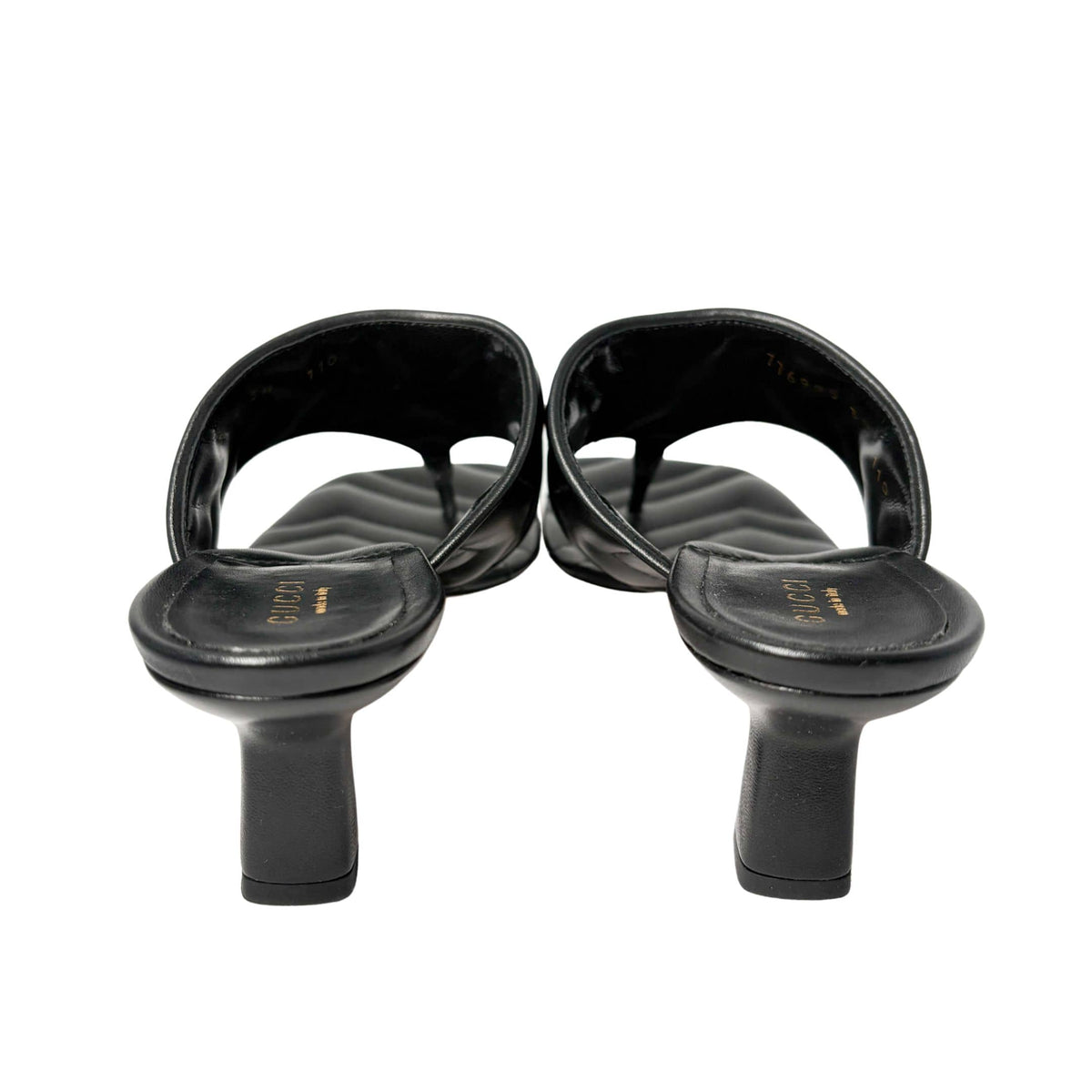 Rear view of the black Gucci Charlotte kitten heel sandals from behind, focusing on the structured heel counters and clean stitching.