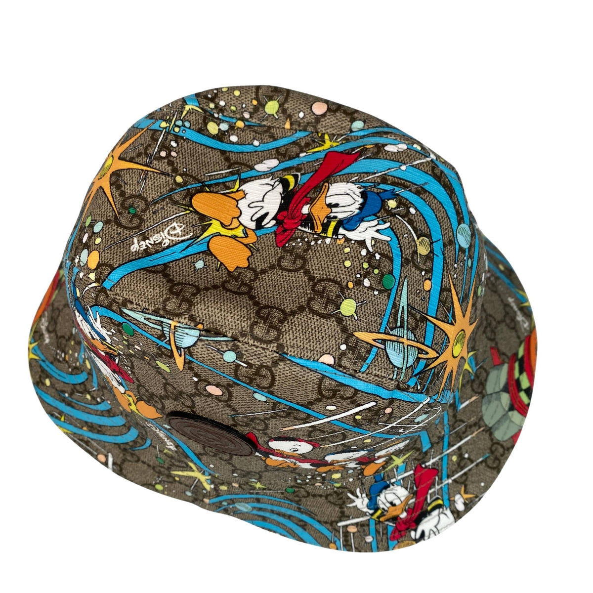 Top-down view of Gucci x Disney Donald Duck bucket hat highlighting crown stitching and full all-over character print