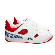 Side profile view of Gucci Flashtrek trainer displaying red side overlays and thick rubber tread sole.
