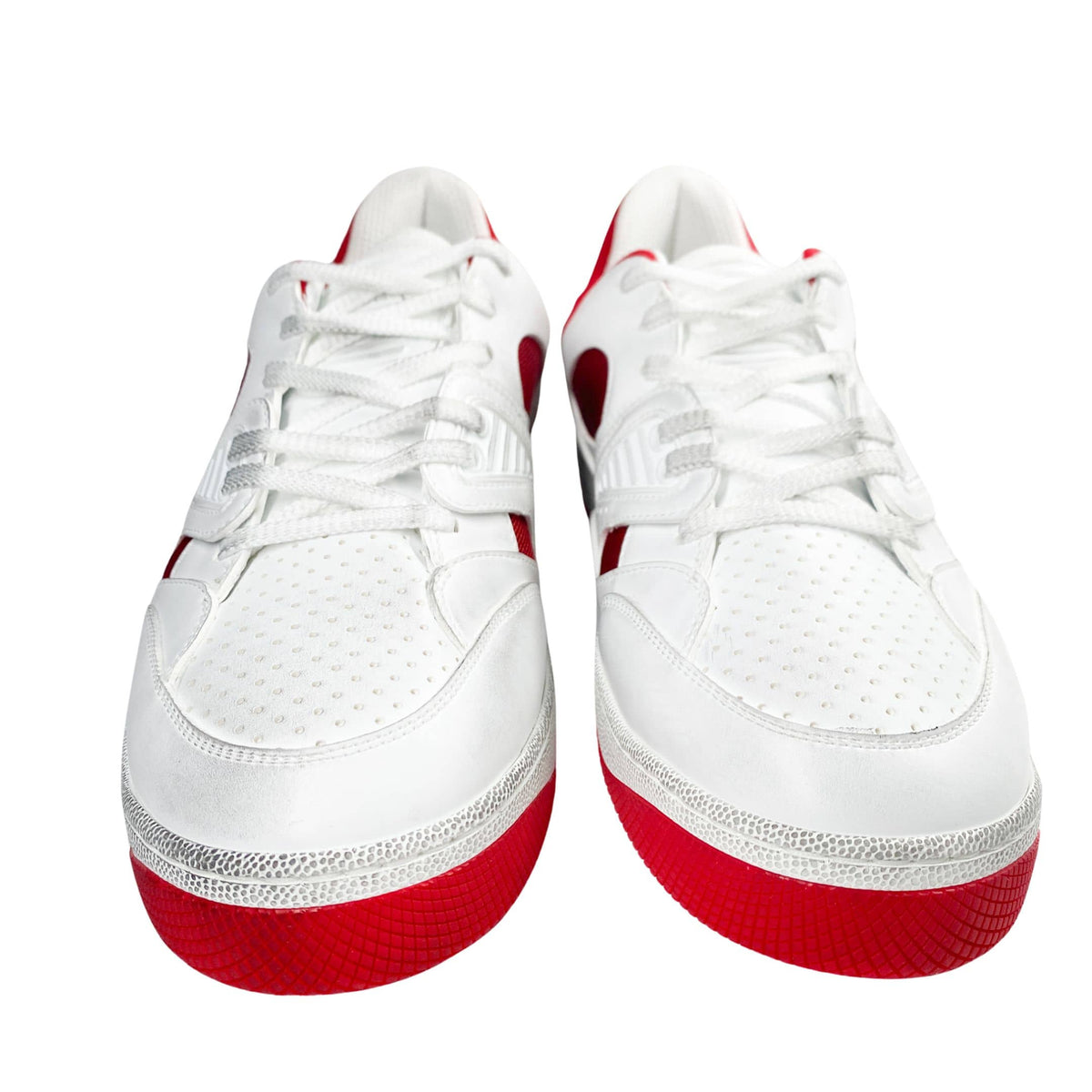 Front view of a pair of white Gucci Flashtrek sneakers featuring SEGA-font logo patches on tongues.