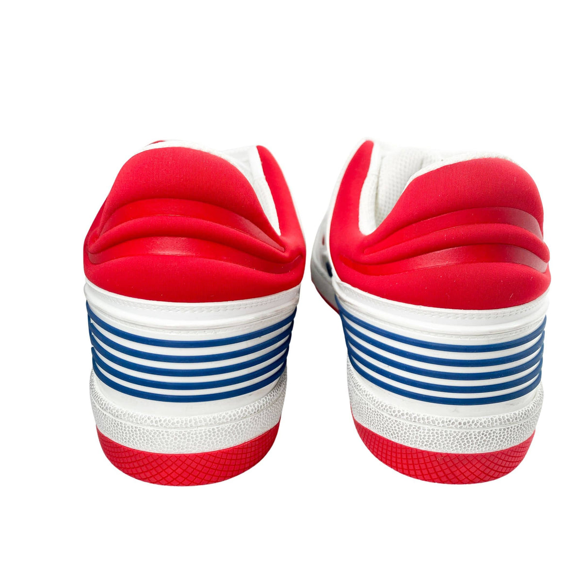 Back view of white Gucci Flashtrek sneakers featuring padded red collar and blue heel tab stripes.