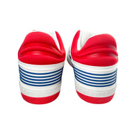 Back view of white Gucci Flashtrek sneakers featuring padded red collar and blue heel tab stripes.