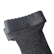 Detailed close-up of the black Gucci net stockings highlighting the ribbed cuff band and delicate GG monogram mesh knit.