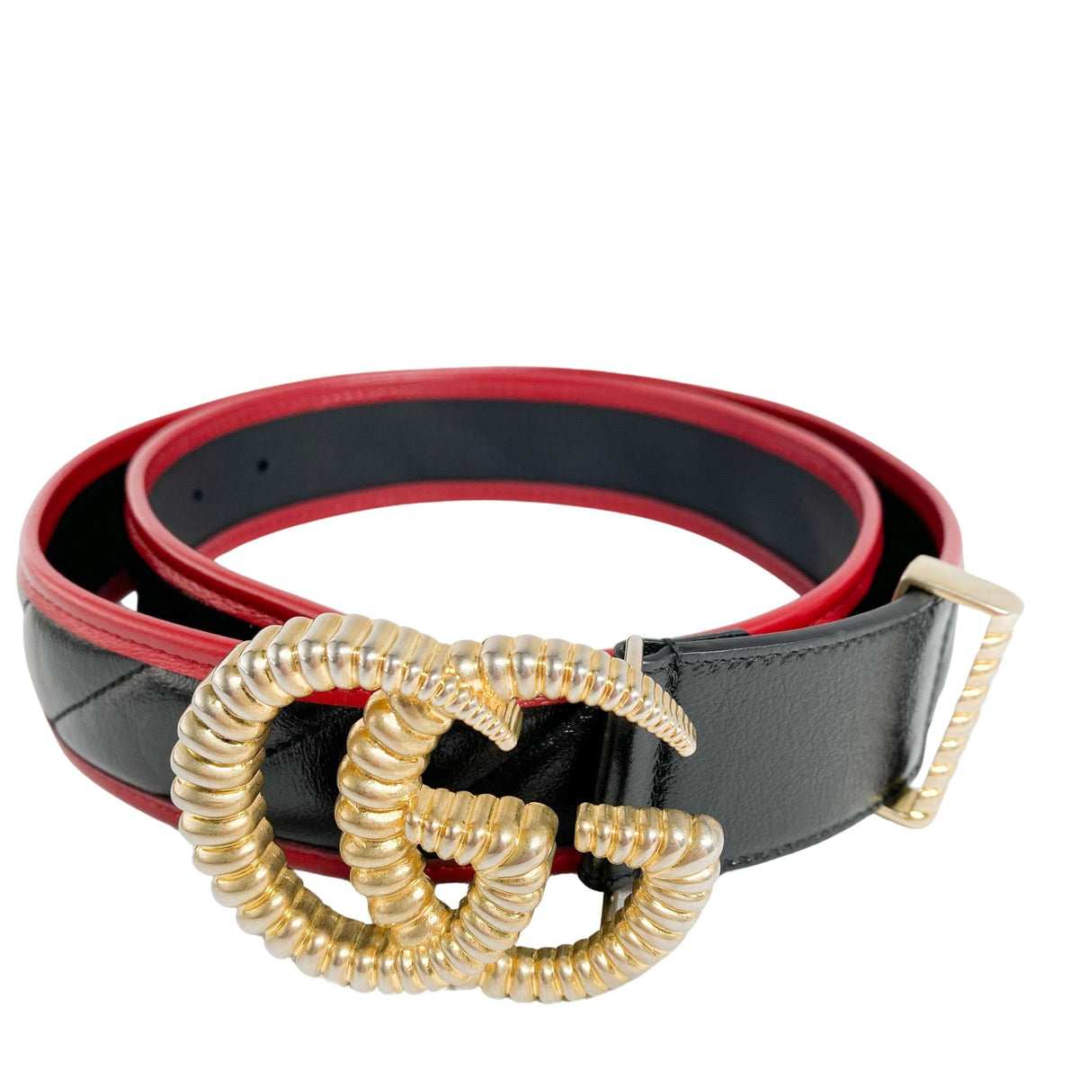 Frontal view of the coiled Gucci Torched belt showcasing the twisted gold double G hardware and smooth leather finish.