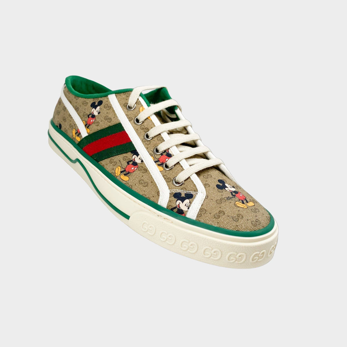 Gucci x Disney Mickey Mouse Mens Tennis 1977 sneaker in GG Supreme canvas with green and red Web stripe.
