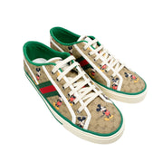 Side profile view of Gucci Tennis 1977 Mickey Mouse low-top sneaker showing green grosgrain trim.