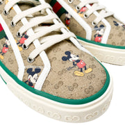 Elevated three-quarter view of men's Gucci x Disney Mickey Mouse Tennis 1977 low-top luxury sneakers.