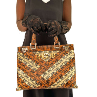 Authentic Gucci Top Handle Bag in exotic python leather featuring refined craftsmanship and timeless elegance