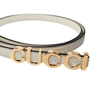Authentic Gucci white Plutone Belt crafted in Italy, showcasing refined design and iconic Gucci craftsmanship