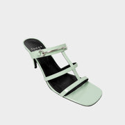 Side profile view of a Gucci Regent heeled sandal in glossy Pacific Green leather, showcasing its sculptural multi-strap design and sleek stiletto heel.