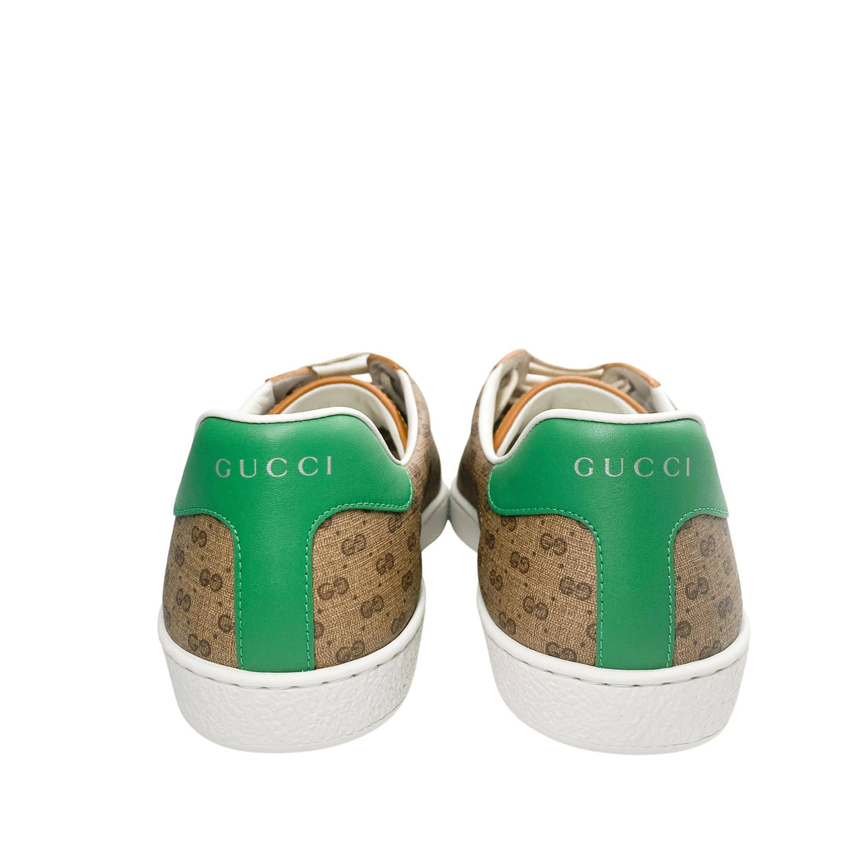 Back view of Gucci x Mickey Mouse Ace sneakers featuring signature green leather heel tabs with metallic Gucci logo.