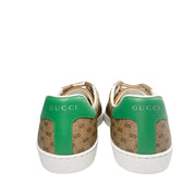 Back view of Gucci x Mickey Mouse Ace sneakers featuring signature green leather heel tabs with metallic Gucci logo.