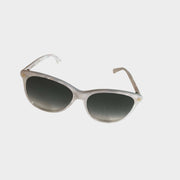 Front angled view of Gucci women's silver frame sunglasses with dark grey gradient lenses