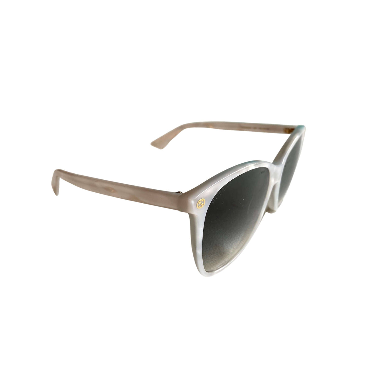 Side profile of Gucci silver sunglasses showcasing sleek metallic temple arm and frame construction