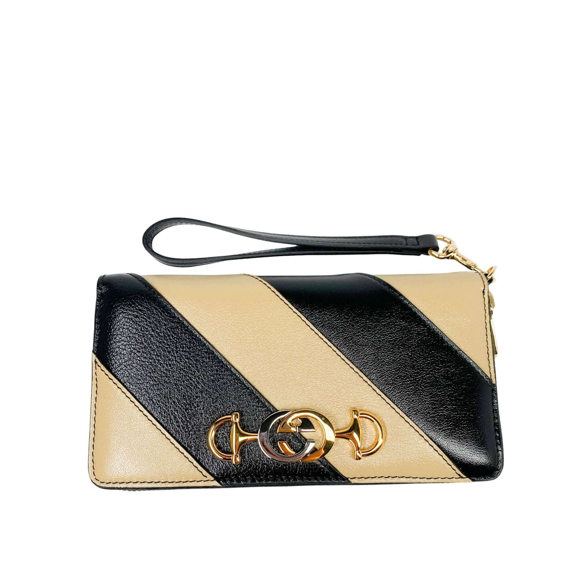 Front view of black and beige diagonal stripe Gucci Zumi continental wallet highlighting the hybrid gold and silver metal logo