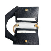 Interior view of the open black Gucci Zumi leather wallet, showing card slots, bill compartment, and snap closure.