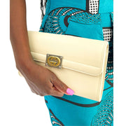 Authentic Gucci white leather clutch featuring interlocking GG logo and polished gold-and-silver hardware detailing