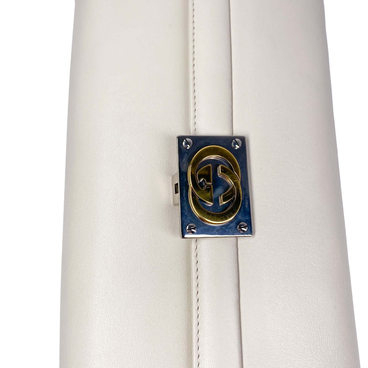 Gucci Interlocking GG Clutch in white - sophisticated leather accessory with signature two-tone hardware and timeless Gucci elegance