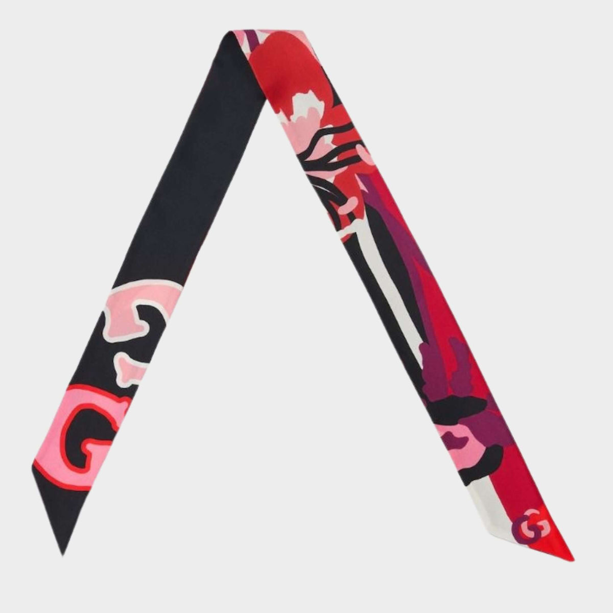 Gucci floral print silk twilly scarf featuring a black GG monogram base, vibrant red borders, and delicate floral graphics.