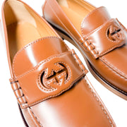 Detailed close-up view of Gucci Millennial Ribot brown loafer toe box showcasing precise stitching and subtle GG branding.