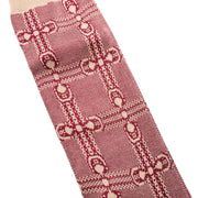 Detailed close-up shot of the vintage athletic-inspired GG monogram knit pattern on the Gucci red and ivory socks.