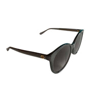 Side profile of Gucci black sunglasses showing classic frame design and temple detail