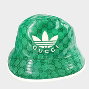 Authentic Gucci x Adidas green and white bucket hat showcasing sporty style and Italian craftsmanship