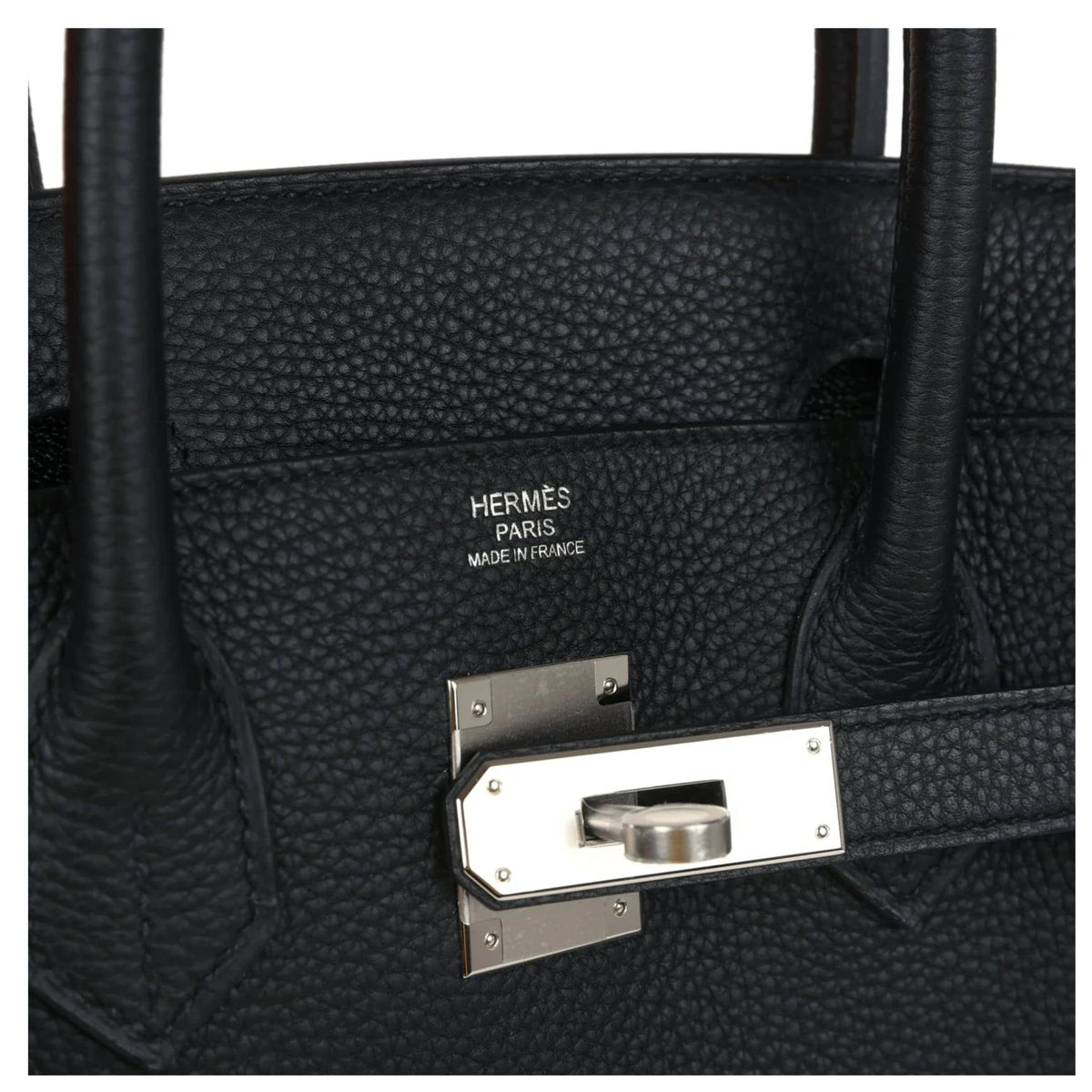 Close-up view of palladium hardware lock, keys, and hanging leather clochette on the Hermès Birkin 30 black handbag.