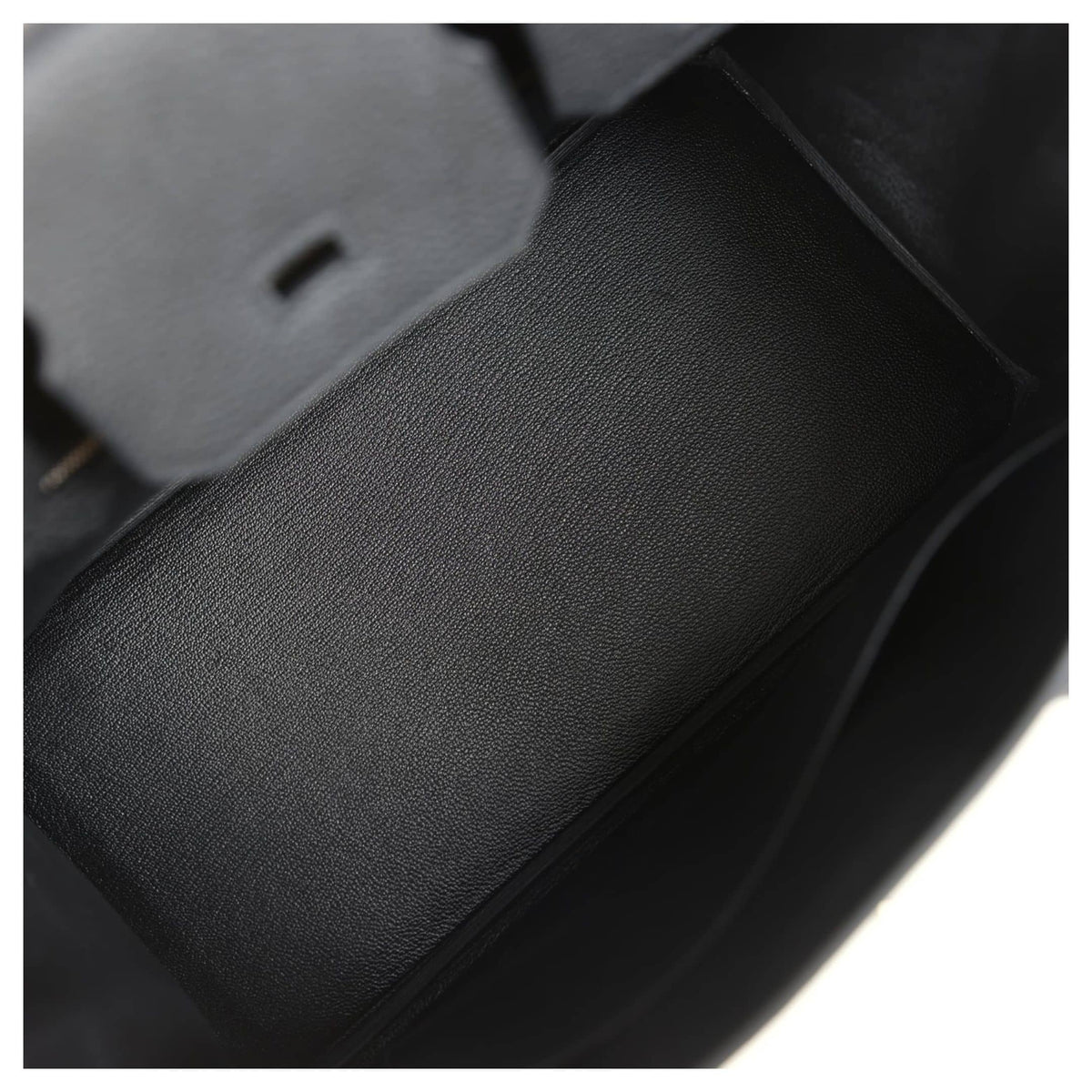Open interior view of Hermès Birkin 30 in black leather showing spacious main compartment and inner side pocket.
