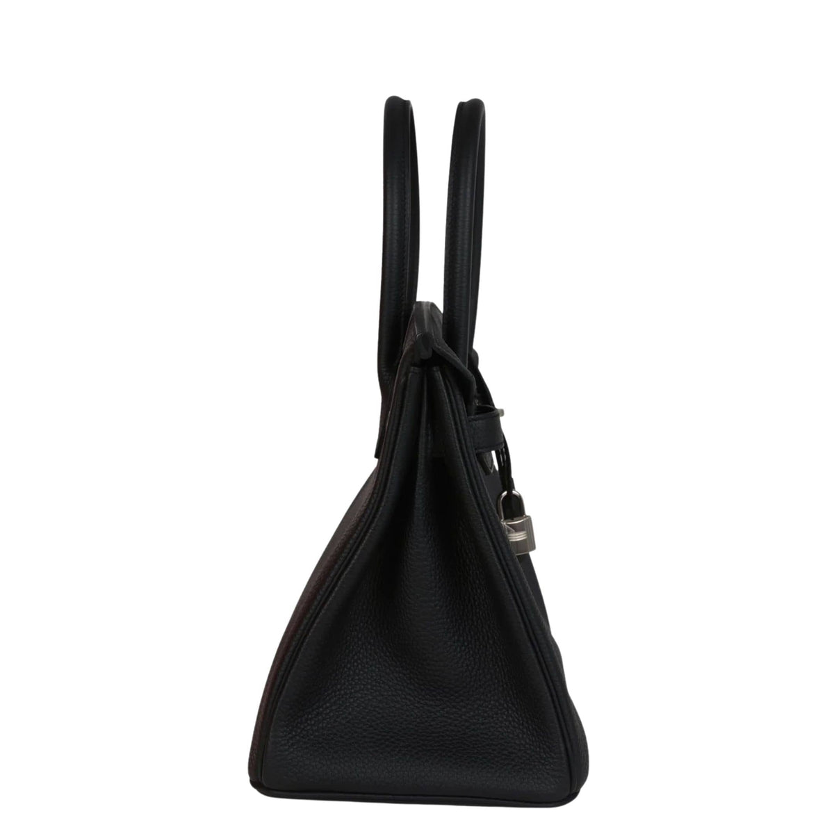 Side profile view of Hermès Birkin 30 in black Togo leather showing structured side gussets and rolled top handles.