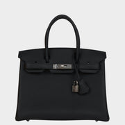 Front view of Hermès Birkin 30 bag in black Togo leather with silver palladium hardware, padlock, and clochette.