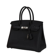 Three-quarter view of Hermès Birkin 30 handbag in black Togo leather with palladium-plated turn-lock closure.
