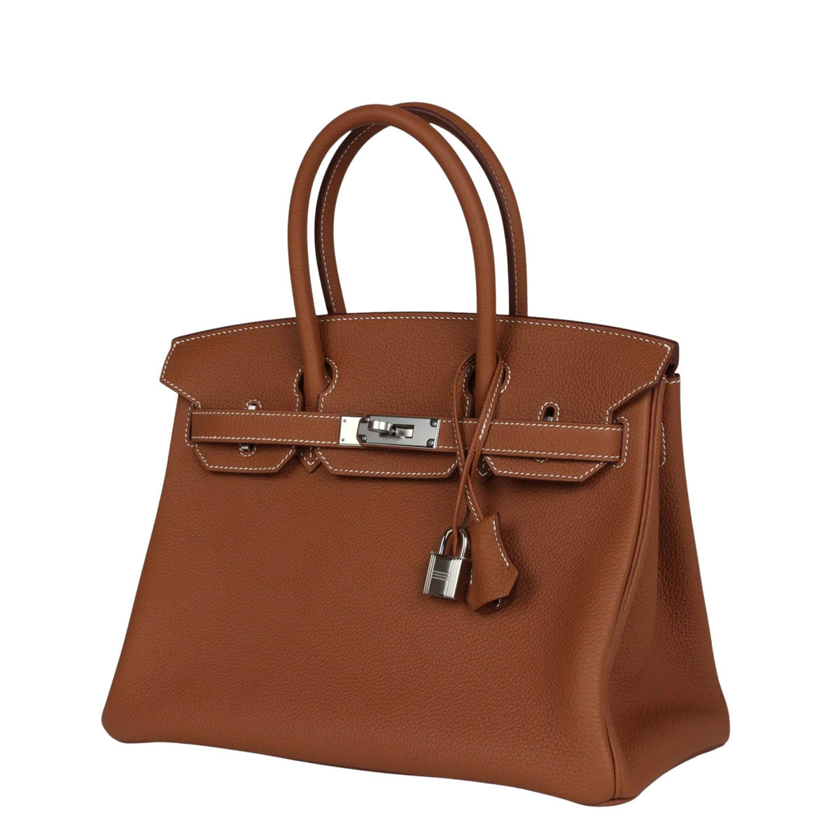 Three-quarter view of Hermès Birkin 30 in iconic Gold Togo leather displaying palladium-plated turn-lock closure and sturdy rolled top handles.