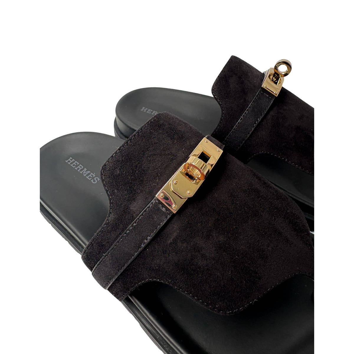 Three-quarter angle of the Rouge Tomette Hermès Chypre slide, showing the adjustable velcro strap wrapped in a textured, earth-toned fabric.