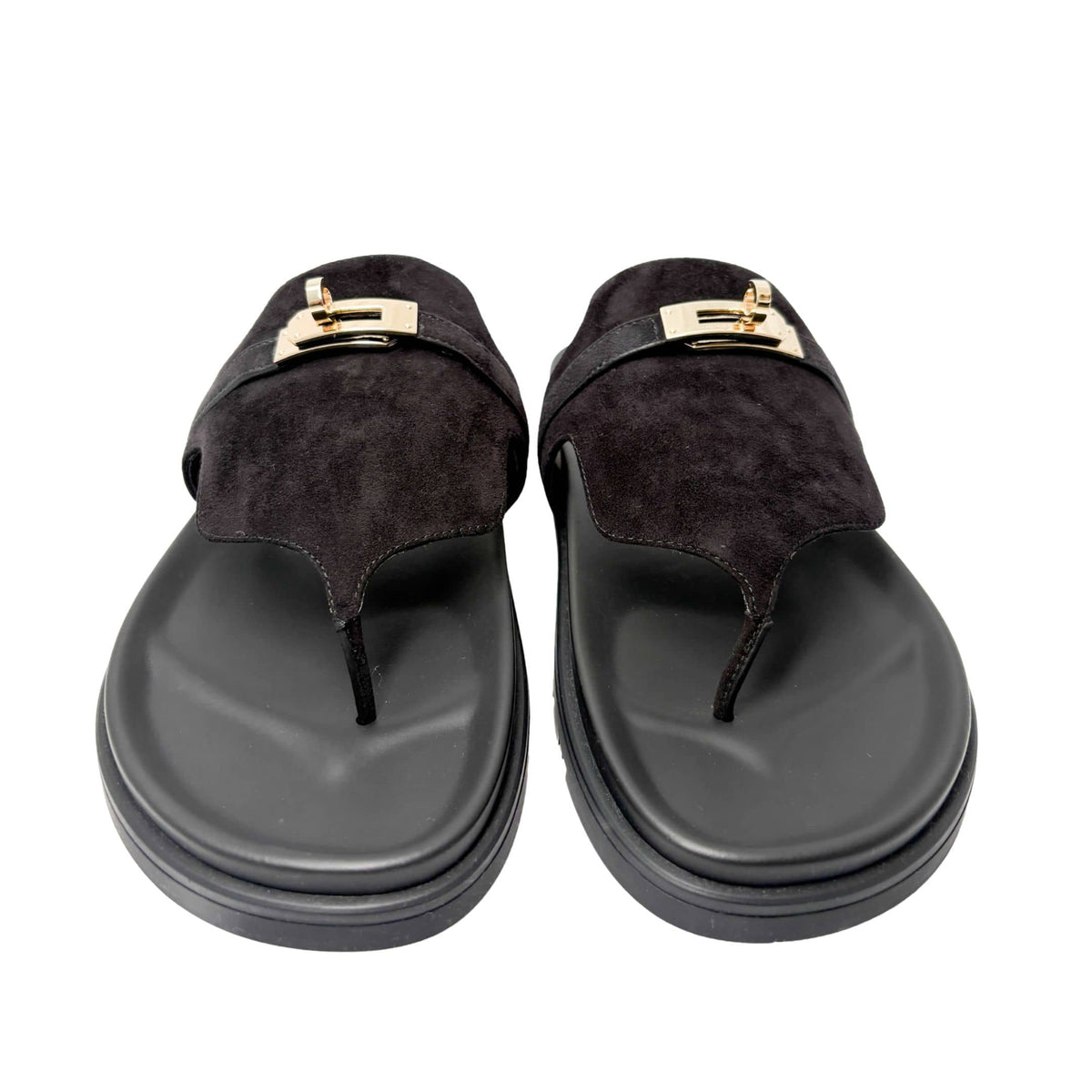 Clean, level horizontal view of a single red and brown Hermès Chypre shoe, showcasing the exact low profile of the $1.2\text{ cm}$ flat sole.