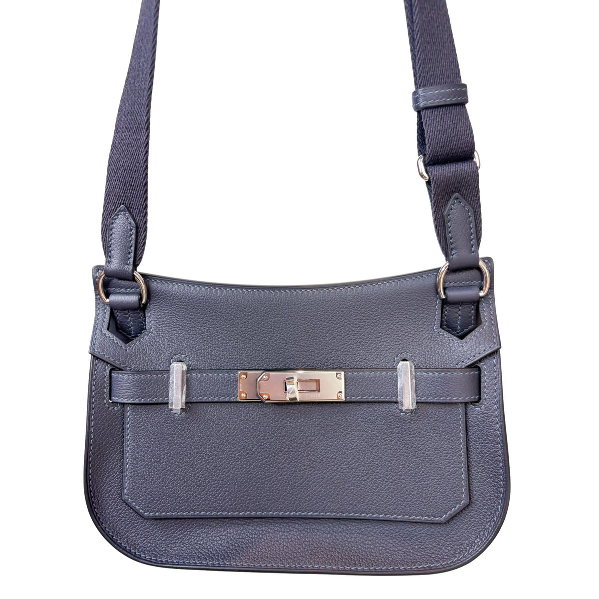 Direct front view of Hermès Jypsière crossbody bag displaying front flap closure, sangles, and polished palladium hardware.