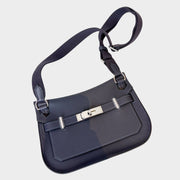 Hermès Jypsière messenger bag in dark blue leather featuring palladium hardware turn-lock closure and adjustable shoulder strap.