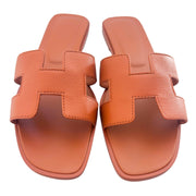 A direct overhead view of the pair, highlighting the matching orange stitched insoles and the elegant open-toe silhouette.