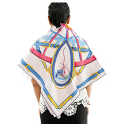 Back view of Hermès En Roue Libre 90cm silk scarf draped over model shoulders showcasing full graphic print and hand-rolled hem