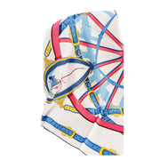 Flat lay view of Hermès En Roue Libre Carré 90 silk scarf highlighting the central wheelwright carriage motif