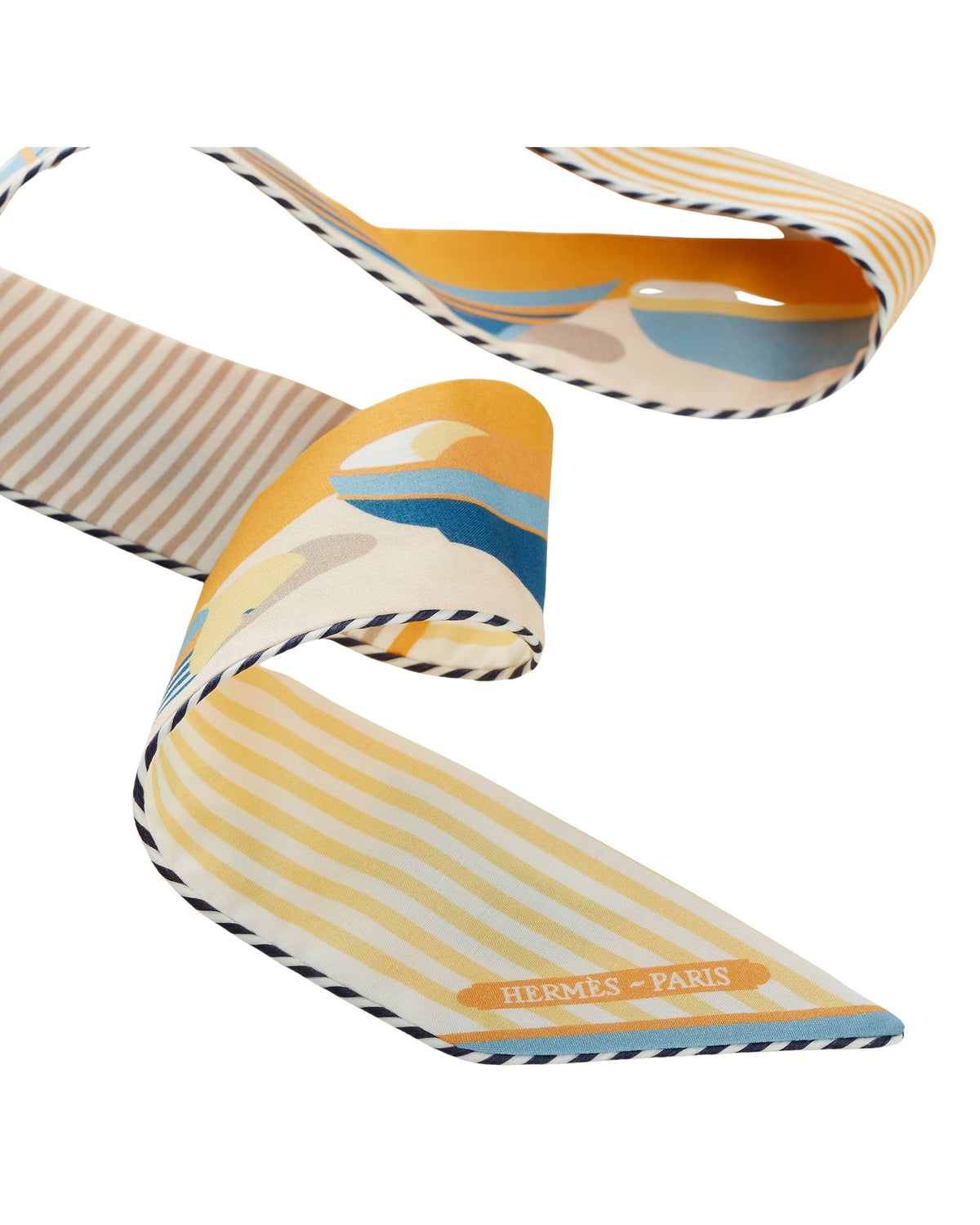 Full-length view of yellow Hermès cotton Twilly ribbon held up to show the slim reversible design created by Pierre Péron