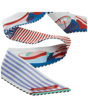 Flat lay view of coiled Hermès cotton Twilly ribbon highlighting graphic nautical stripes and lightweight cotton weave