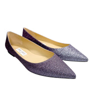 A close-up three-quarter view looking down at the front of the Alina flats, drawing focus to the sharp taper of the glamorous pointed toes.
