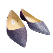 An off-center studio pairing of the glittery Alina flats, beautifully catching the light to highlight the depth of the deep purple and silver shimmer.