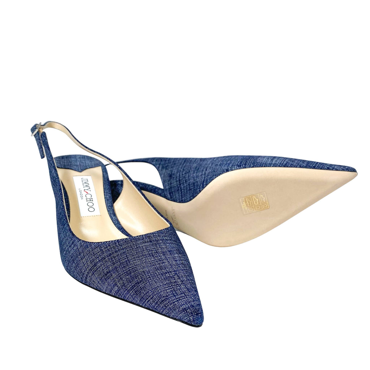 Side angle detail view highlighting the natural leather outsole and pointed toe of Jimmy Choo Harper 65 denim heels.