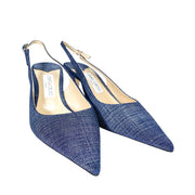 Front view of a pair of Jimmy Choo Harper 65 pointed-toe blue denim slingback pumps displayed on a studio background.