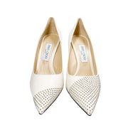 Three-quarter studio view of Jimmy Choo Love 100 off-white studded leather pumps detailing the dramatic point toe.